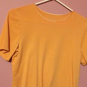 Light orange short sleeve knit top